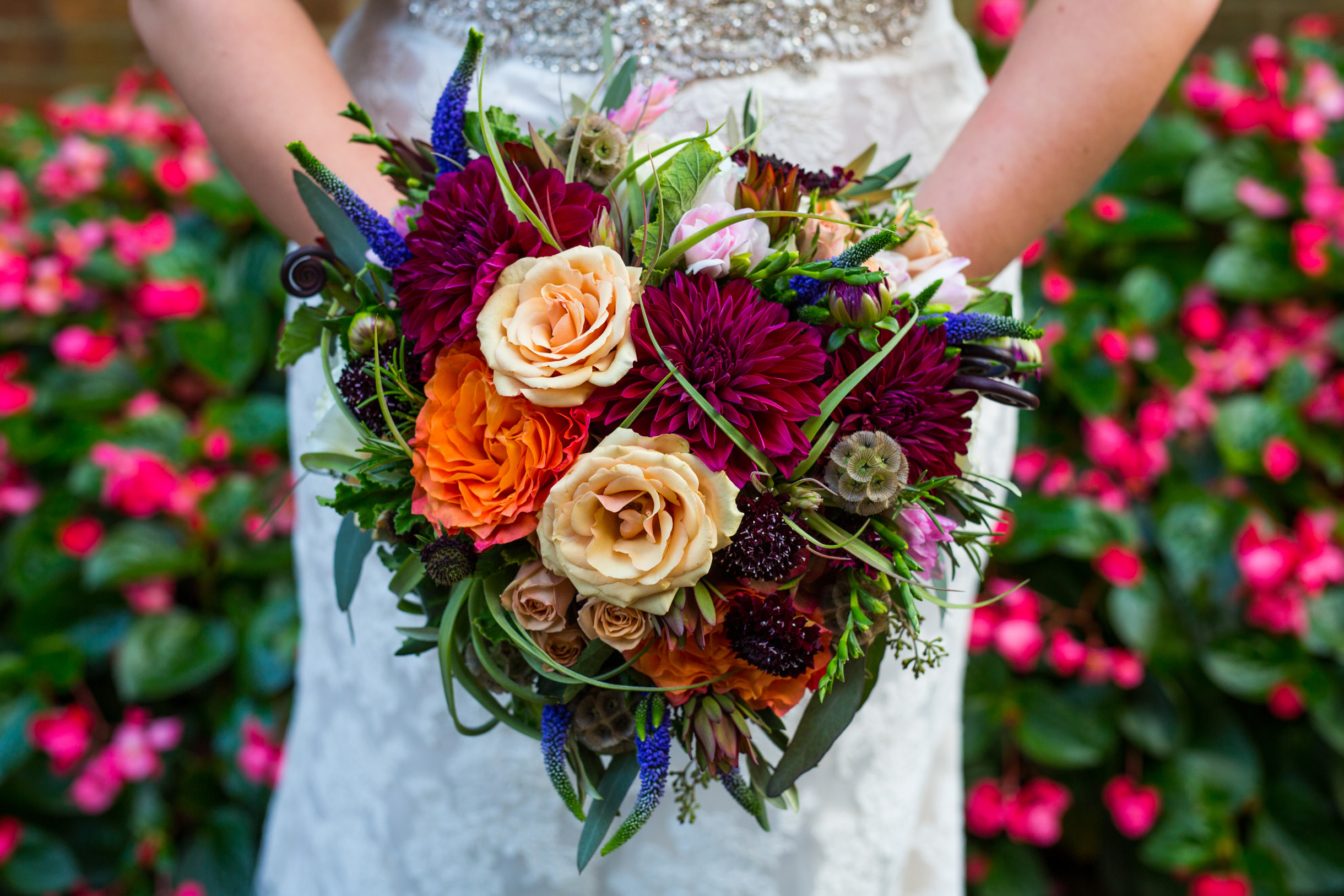 Bride colorful bouquet with wildflowers and roses