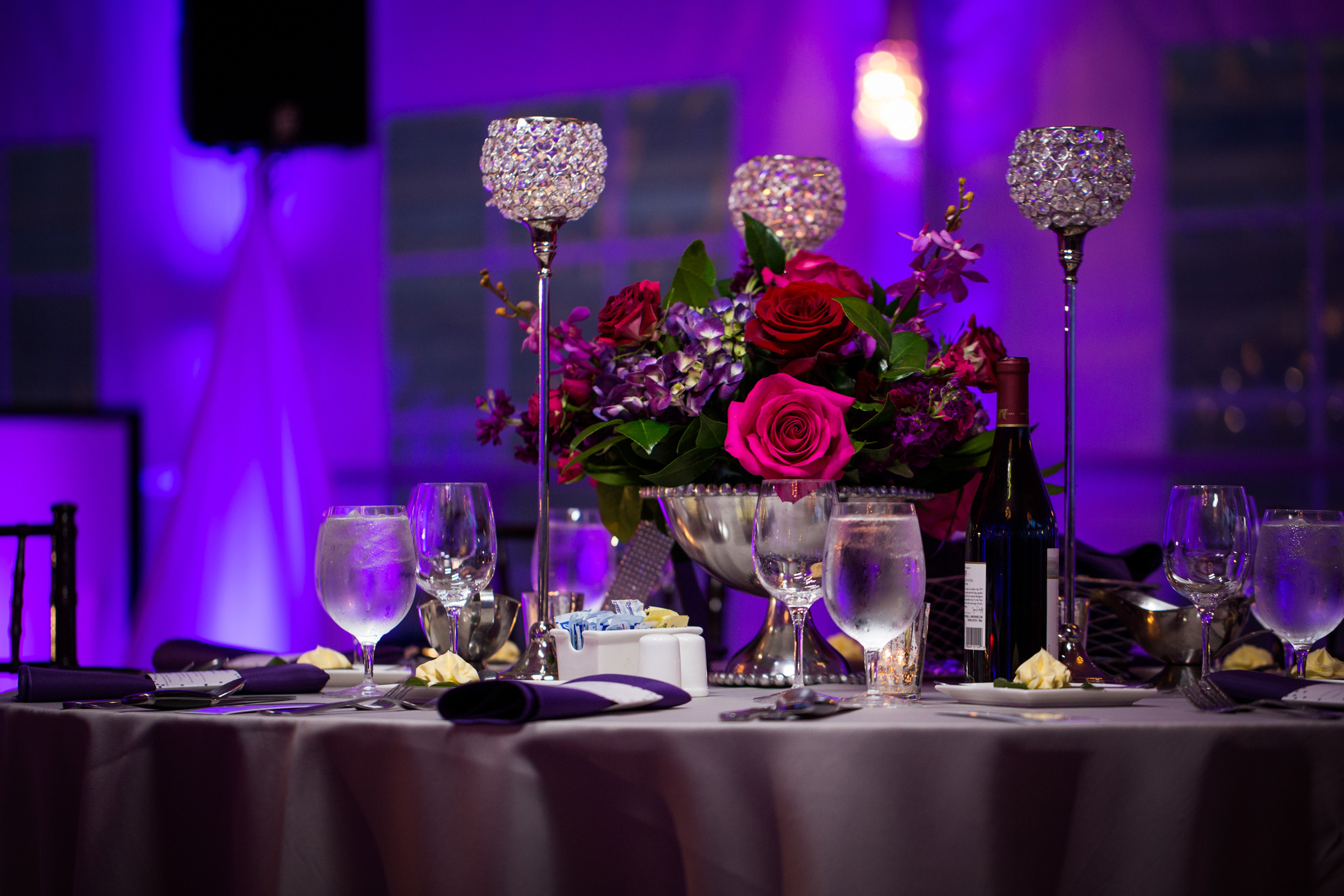 THE BIGGEST WEDDING TRENDS OF 2024 Jason Kaczorowski Photography   Purple Wedding Reception Decor With Red And Purple Flowers 187 