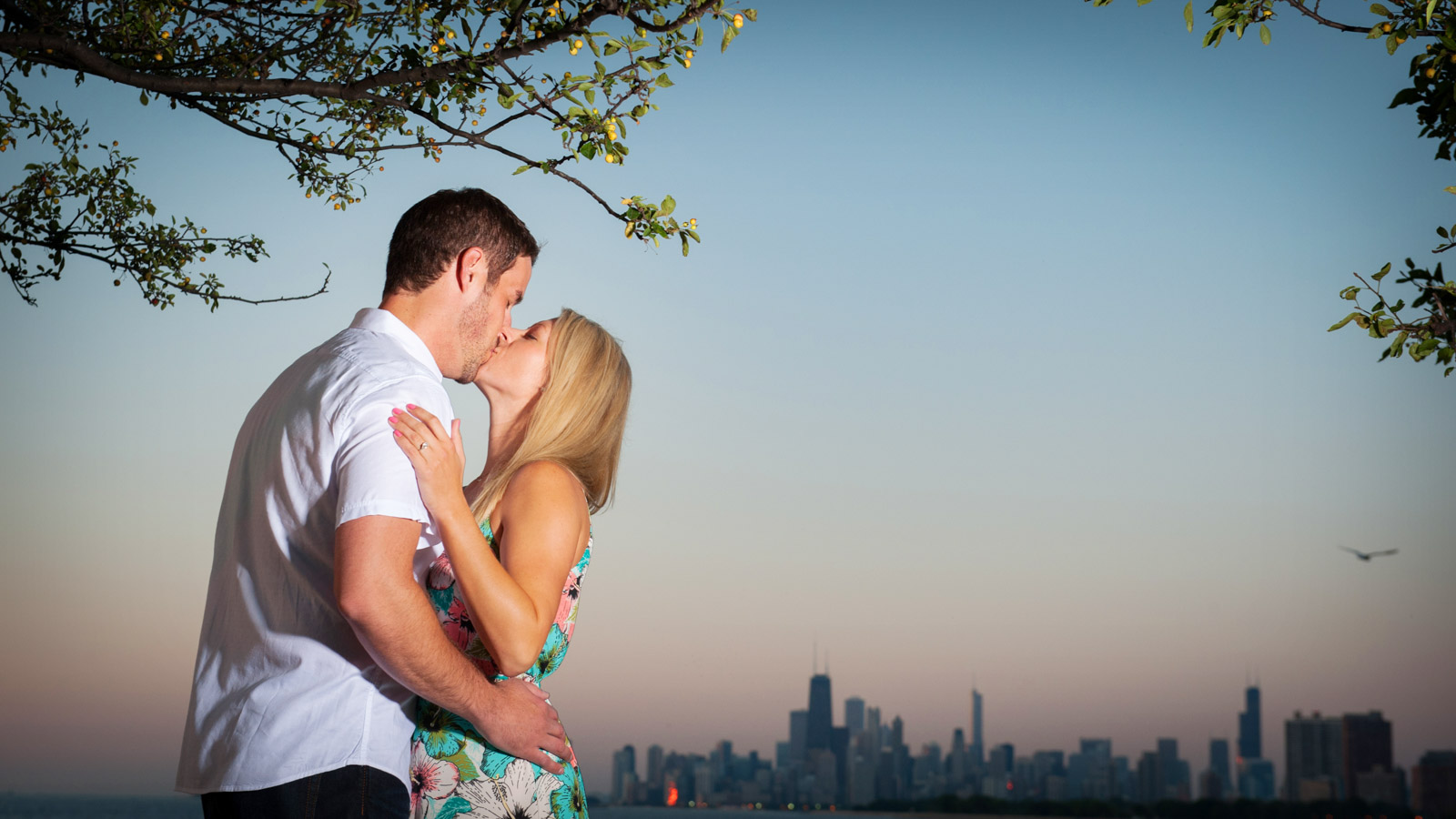 Chicago engagement session at sunrise on Lake Michigan with Chicago Skyline in the background