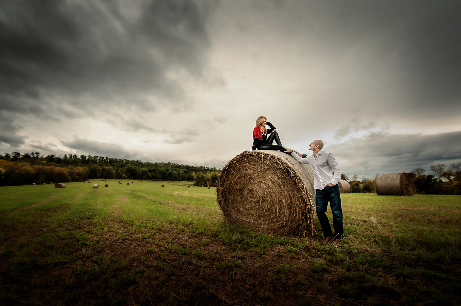 Engagement Session on a bale of hay in a country field