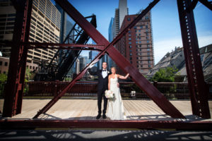 Colorful photo of Bride and Groom on Kinzie Street Bridge in Chicago
