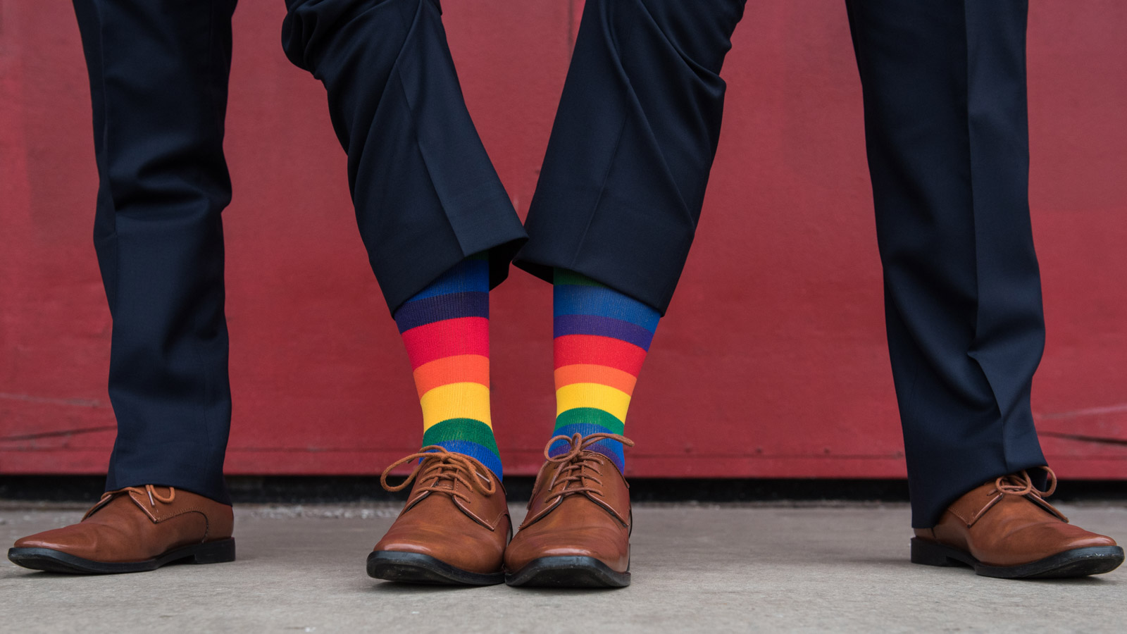Same sex grooms wedding rainbow socks gay wedding inspiration