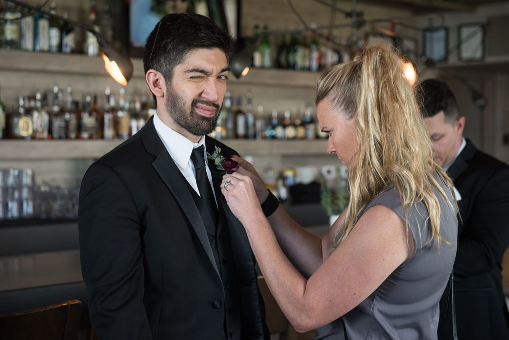 Groomsmen getting Boutonnière flower