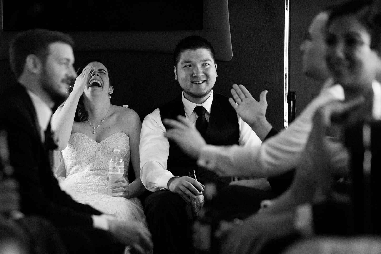 Bride Groom laughing limo bus