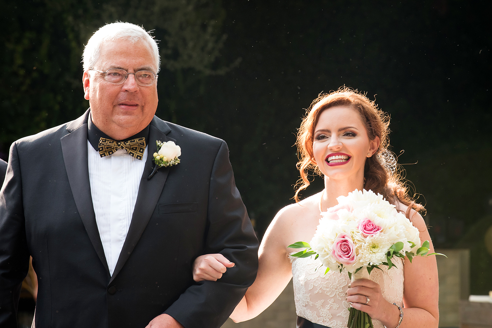 Bride walking down aisle with dad