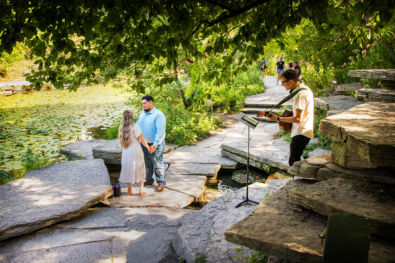 Chicago Proposal Guitarist Eric Taylor performs at the Alfred Caldwell Lily Pond in Chicago